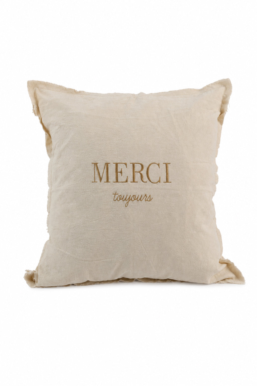 Cojín decorativo de tela con frase Merci Toujours bordada en beige sobre fondo crudo, borde deshilachado